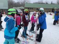 Kissing Bridge instructor with kids listening for lessons