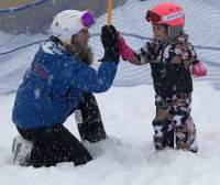 Kissing Bridge Instructor with child giving instructor high five.